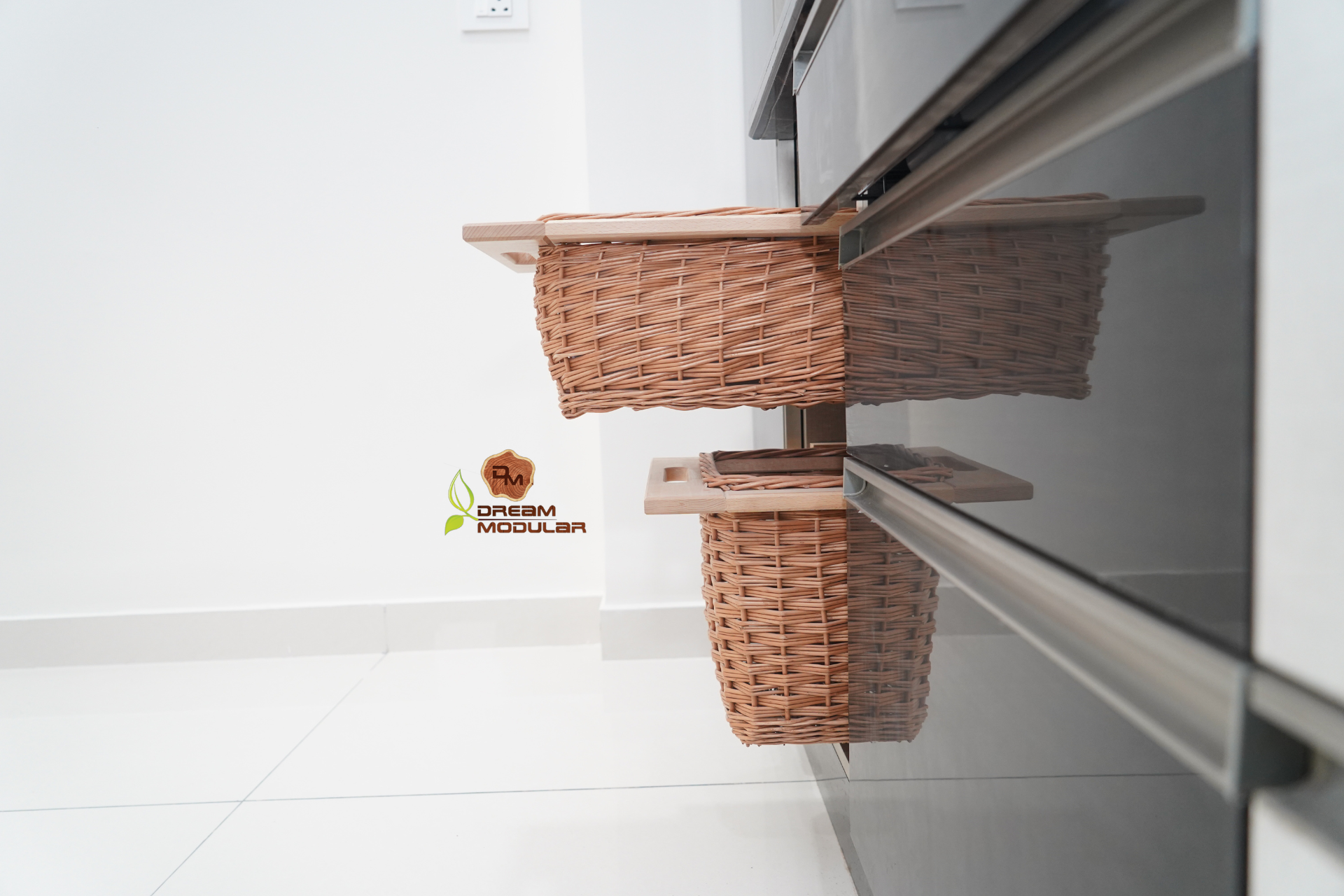 A wicker basket hanging on the side of utensils cabinet, adding a stylish touch to the interior design.