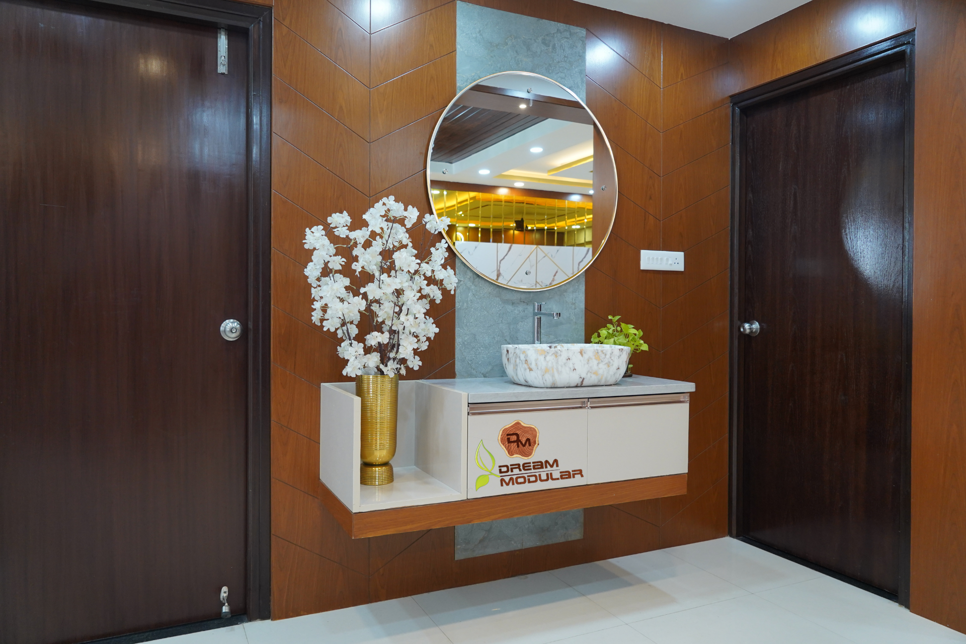 A vanity unit with wooden paneling and a mirror, designed by Dream Modular an interior design company in Hyderabad and backed by warranty.